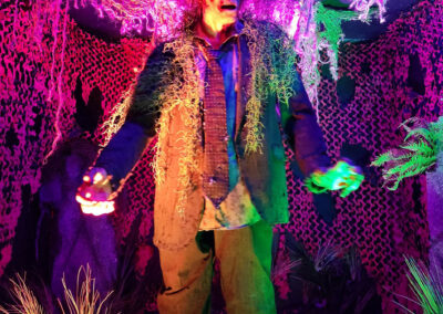A large animatronic zombie entertains guests at the Vampire Lounge