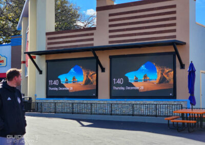 Screens outside Six Flags Universe store displaying the Windows login screen