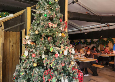 A Christmas tree with guest-decorated ornaments