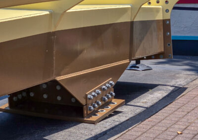 Lots of nuts and bolts connecting the track to a support element
