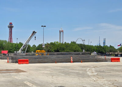 Long sections of rebar begin to arrive