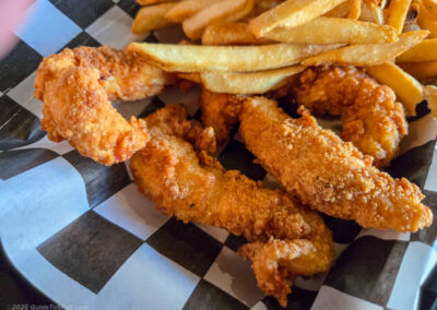 Hand-breaded chicken tenders with fries