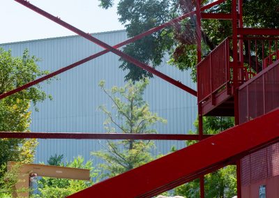 Sprinkler mounted high up on Oil Derrick for heat relief