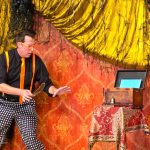 Magician Mike Williams performing a trick