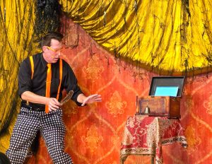 Magician Mike Williams performing a trick