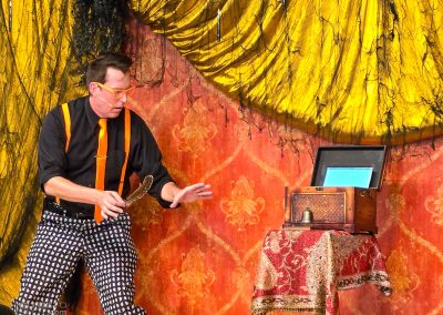 Magician Mike Williams performing a trick